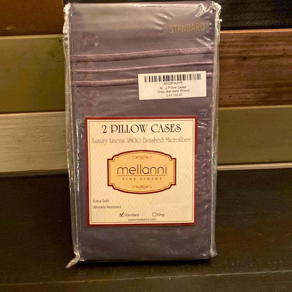 Brand new in package two slate gray standard pillow cases!